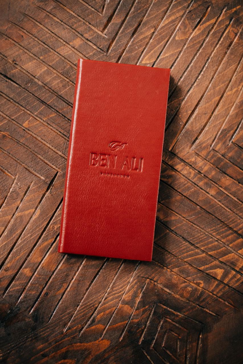 Ben Ali menu on carved wood