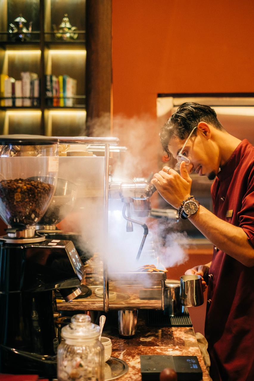 Steam rising from the espresso machine